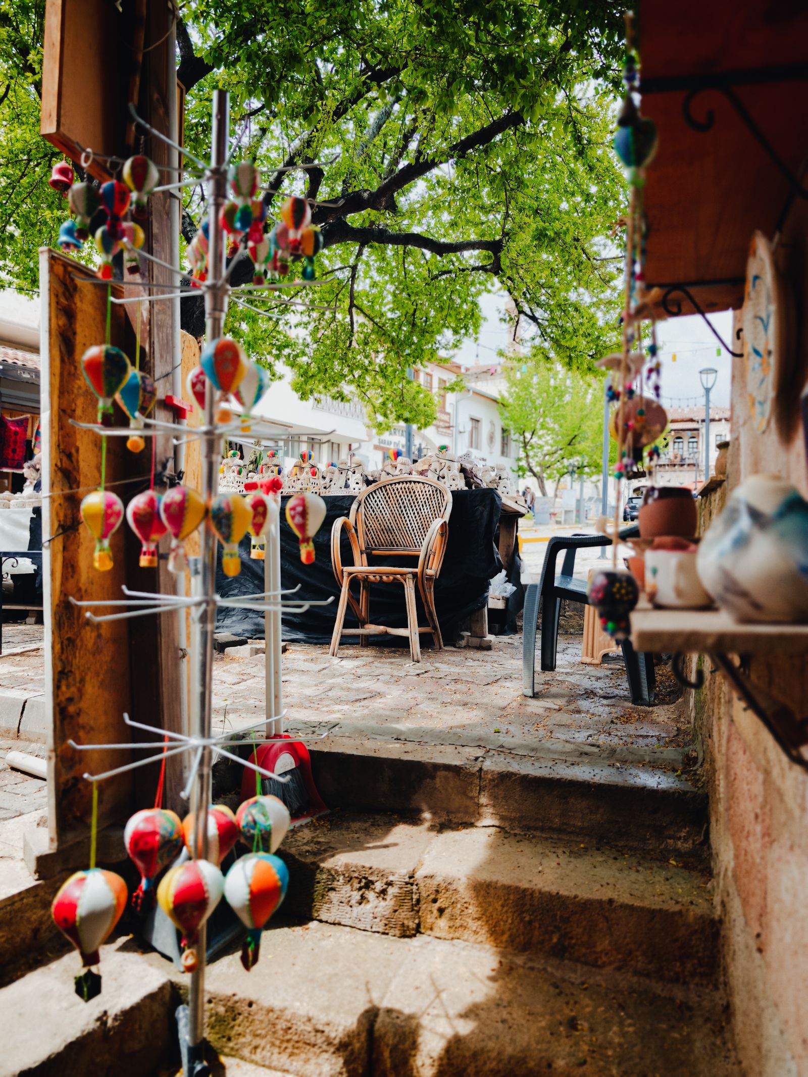 Craft street in Avanos with ceramic ornaments hanging in the shade